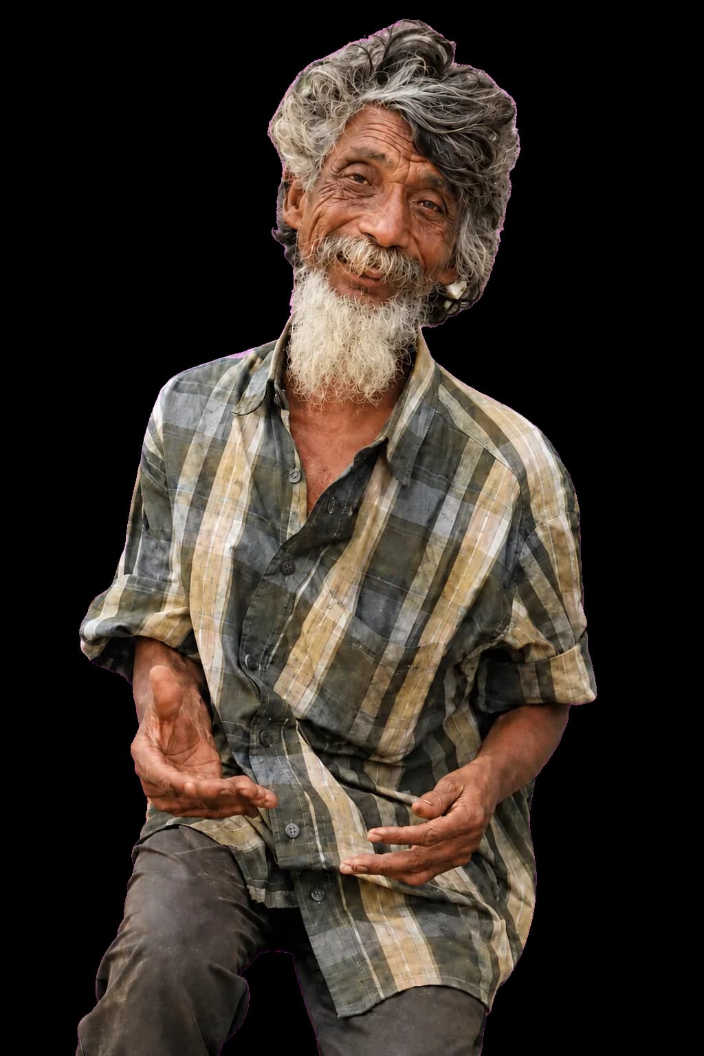 An older man with a grey beard, seated in a checked shirt.